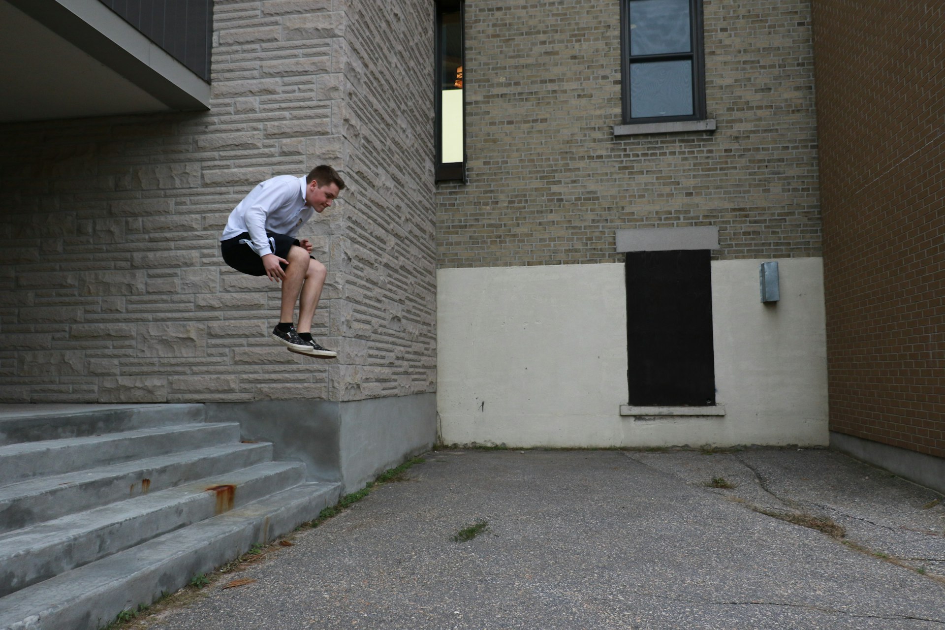 man jumping on steps